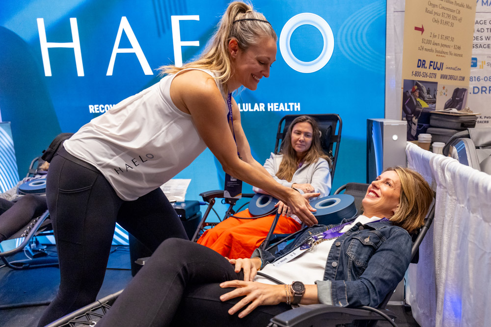 woman relaxing on a lounge chair trying out Biology & Longevity tech