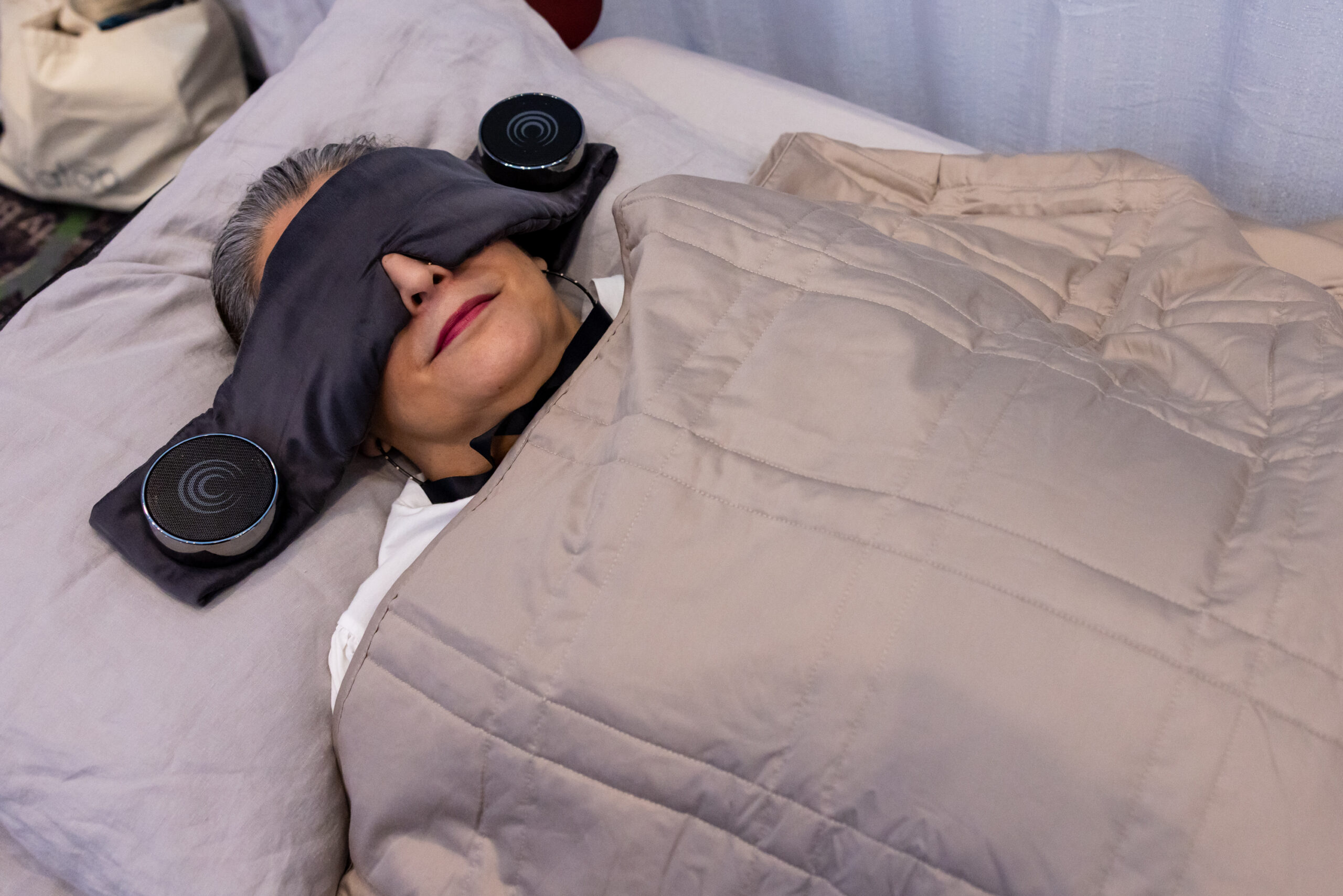 woman under a weighted blanket