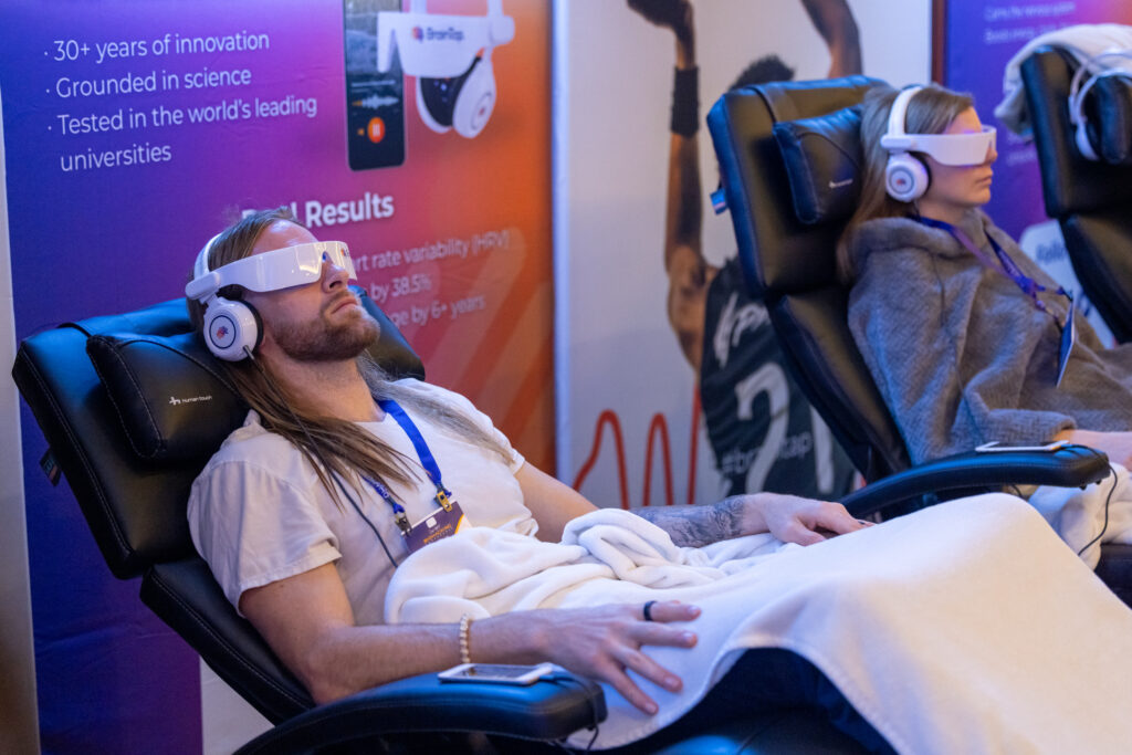 People wearing BrainTap head and eye gear.